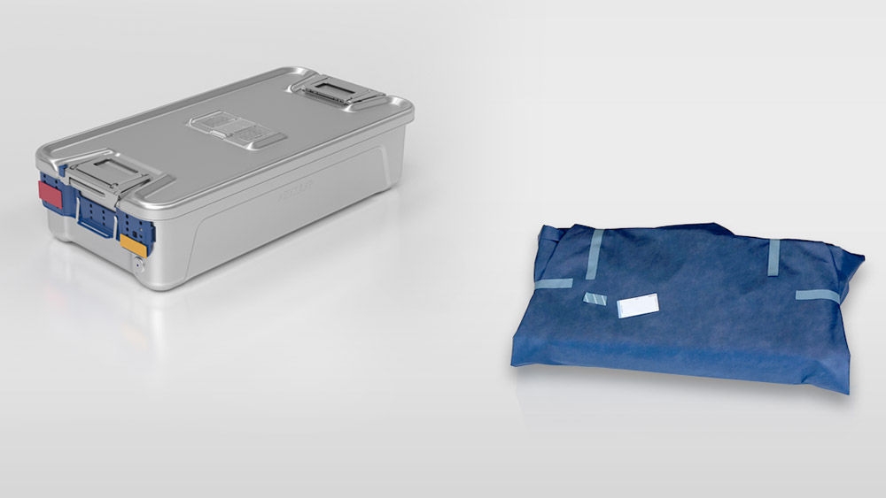 Healthcare professional looks at key findings from a study: Sterile containers vs. single-use wrap on her PC