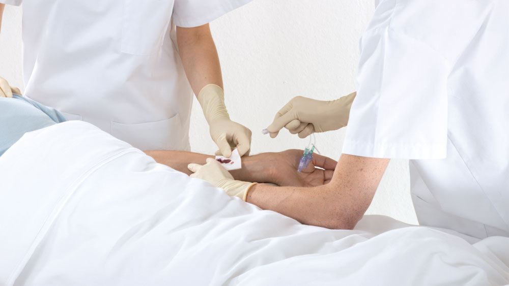 Nurse touching a bloody gauze