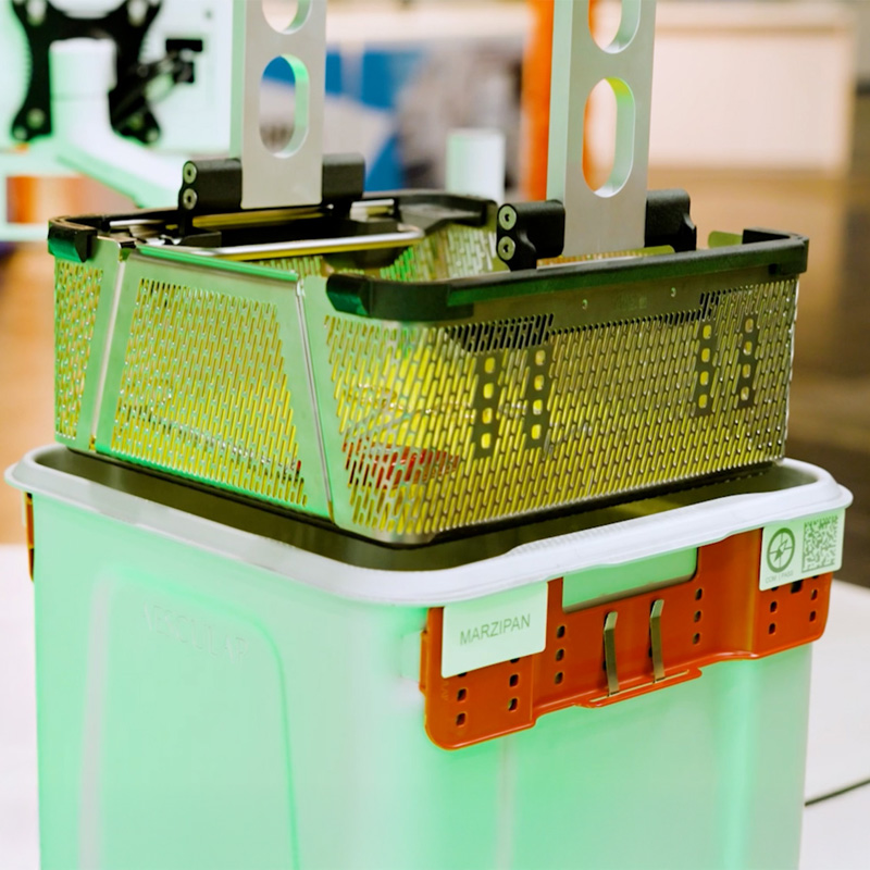  Instrument basket is automatically removed from the sterile container.